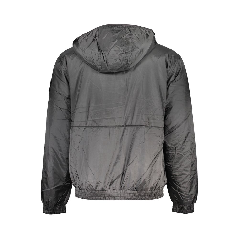 Hooded Windbreaker Jacket by Calvin Klein for men in polyester black features an stylish silhouette, showcasing a sophisticated and performance-driven pockets, hooded & windproof for a premium, stylish look.
