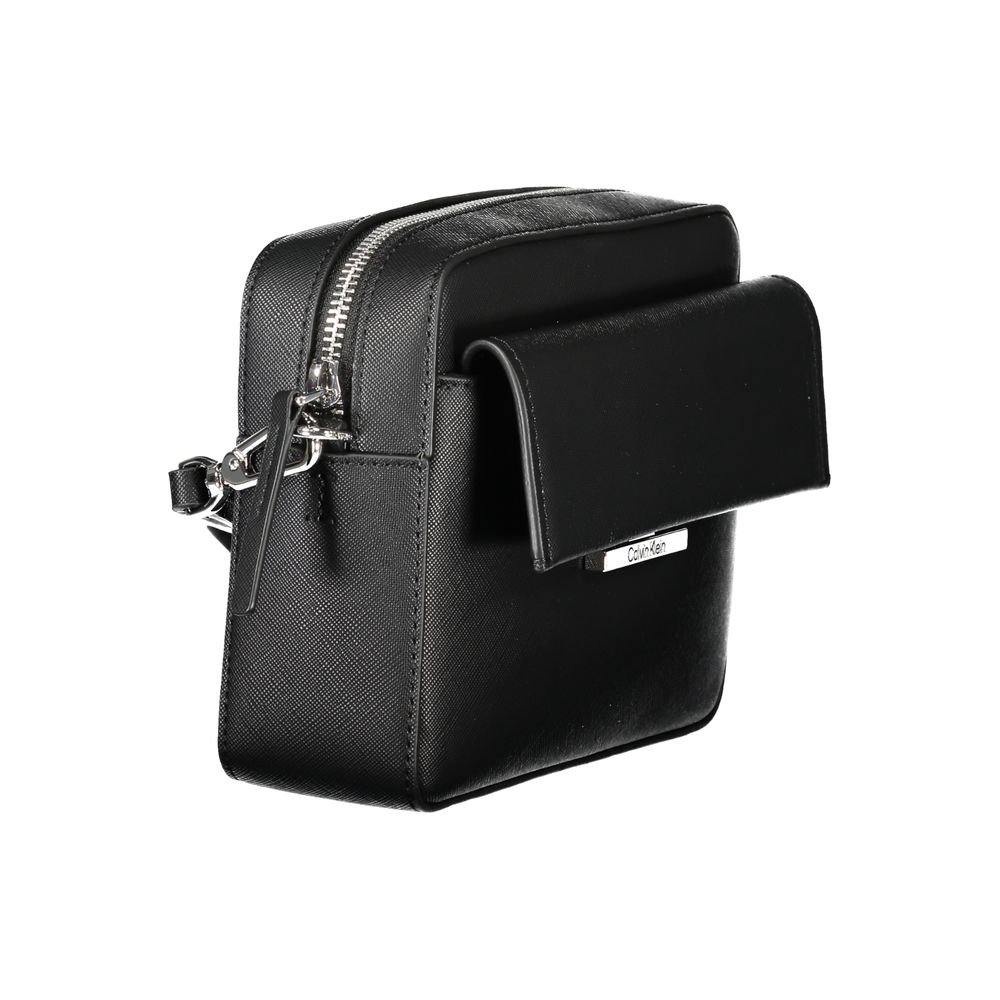Crossbody Handbag by Calvin Klein for women in polyethylene black features a refined silhouette, showcasing a secure snap, organized external-pockets & internal-pockets, and versatile crossbody-strap & adjustable-strap for a refined finish.