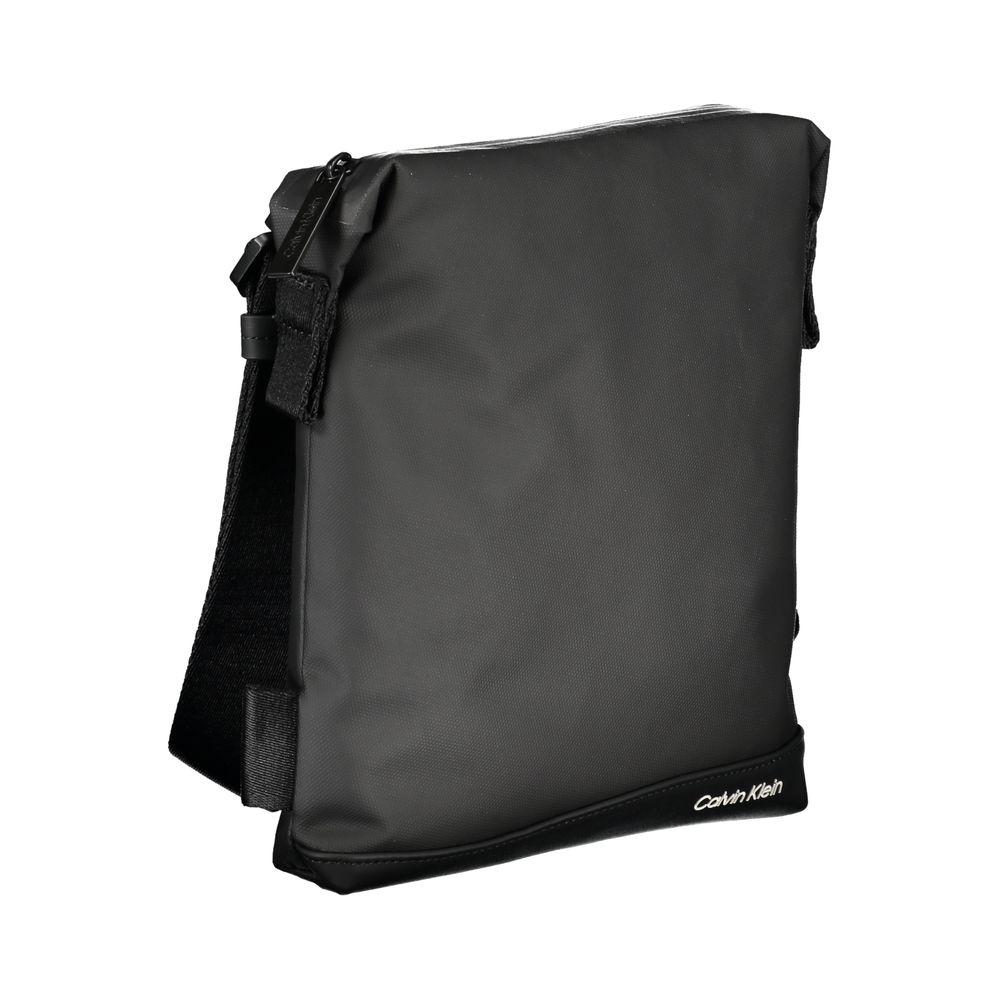 Shoulder Bag by Calvin Klein for men in polyester & polyethylene black features a stately silhouette, showcasing a secure zipper, ample external-pockets & internal-pockets, and stately shoulder-strap & adjustable-strap for a stately finish.