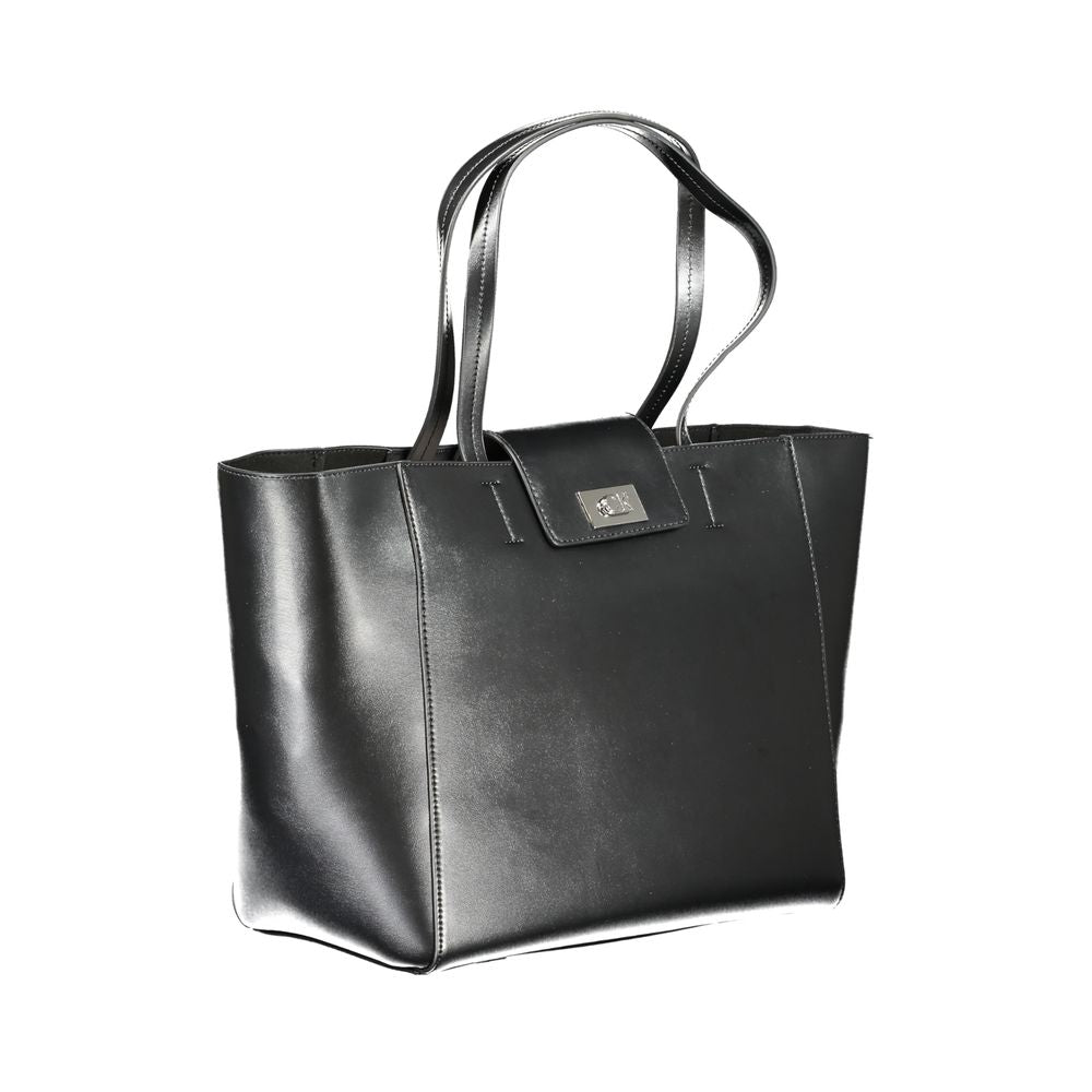 Shopper Handbag by Calvin Klein for women in polyester faux leather black presents a ornamental silhouette, showcasing a secure snap, ample internal-pockets, and versatile handle for a ornamental finish.