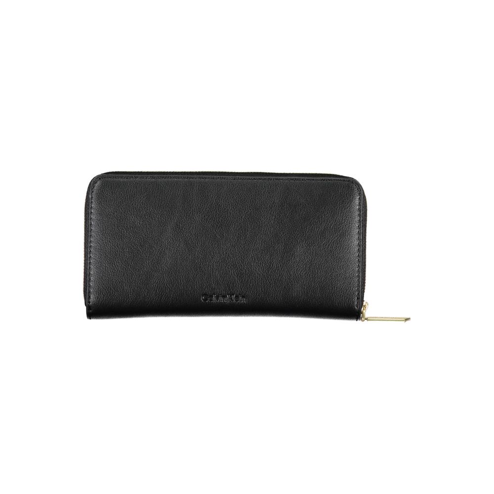 Wallet by Calvin Klein for women in polyester black showcases a discerning silhouette, artfully capturing the essence of Polyester Wallet with its functional rfid-protection coin-purse.