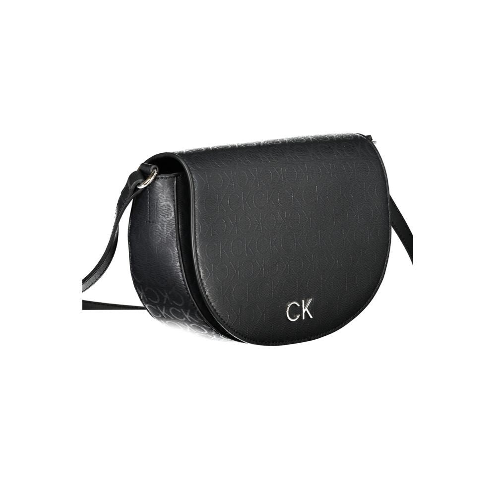 2-in-1 Shoulder & Crossbody Handbag by Calvin Klein for women in polyethylene faux leather black, jacquard & signature presents a ornamental silhouette, showcasing a secure magnetic, ample cardholder, and versatile crossbody-strap, shoulder-strap & adjustable-strap for a ornamental finish.