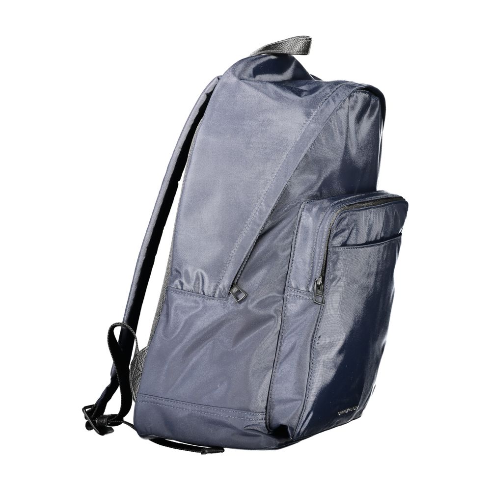 Backpack by Tommy Hilfiger for men in polyester blue presents a stately Polyester Backpack design, showcasing a secure zipper with ample external-pockets, internal-pockets & laptop-compartment and versatile handle, backpack-strap & adjustable-strap for a stately finish.