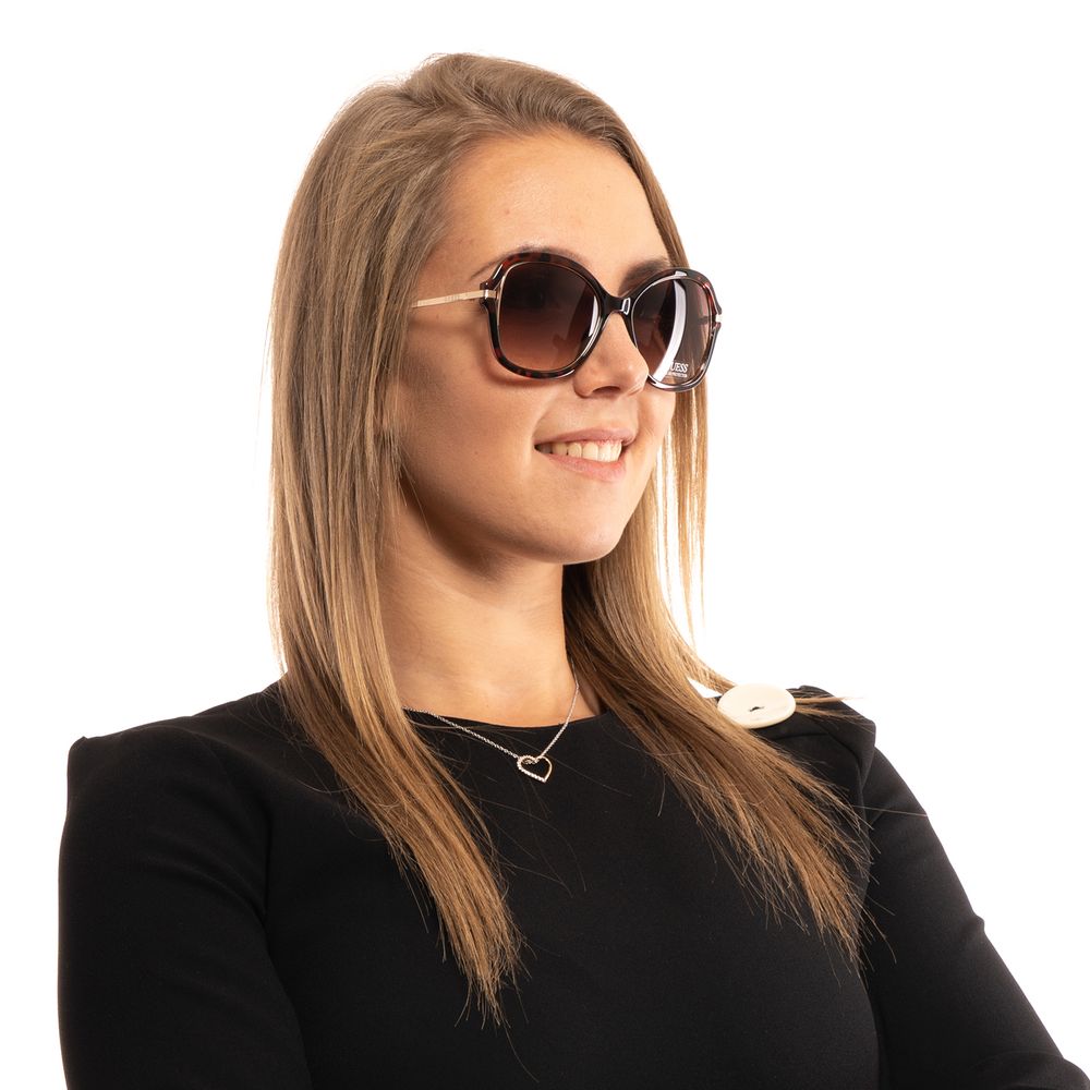 Sunglasses by Guess for women in brown features a contemporary silhouette, showcasing a contemporary butterfly full-rim frame design in brown coloured frame with high-performance gradient category-2-medium-tint lens.