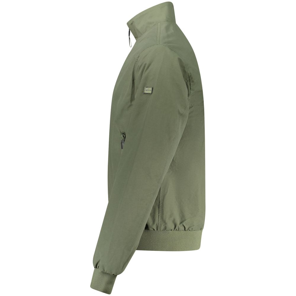 Cape by Norway 1963 for men in polyamide cotton green & signature showcases a enveloping silhouette, elegantly detailed with a enveloping and premium pockets & windproof.