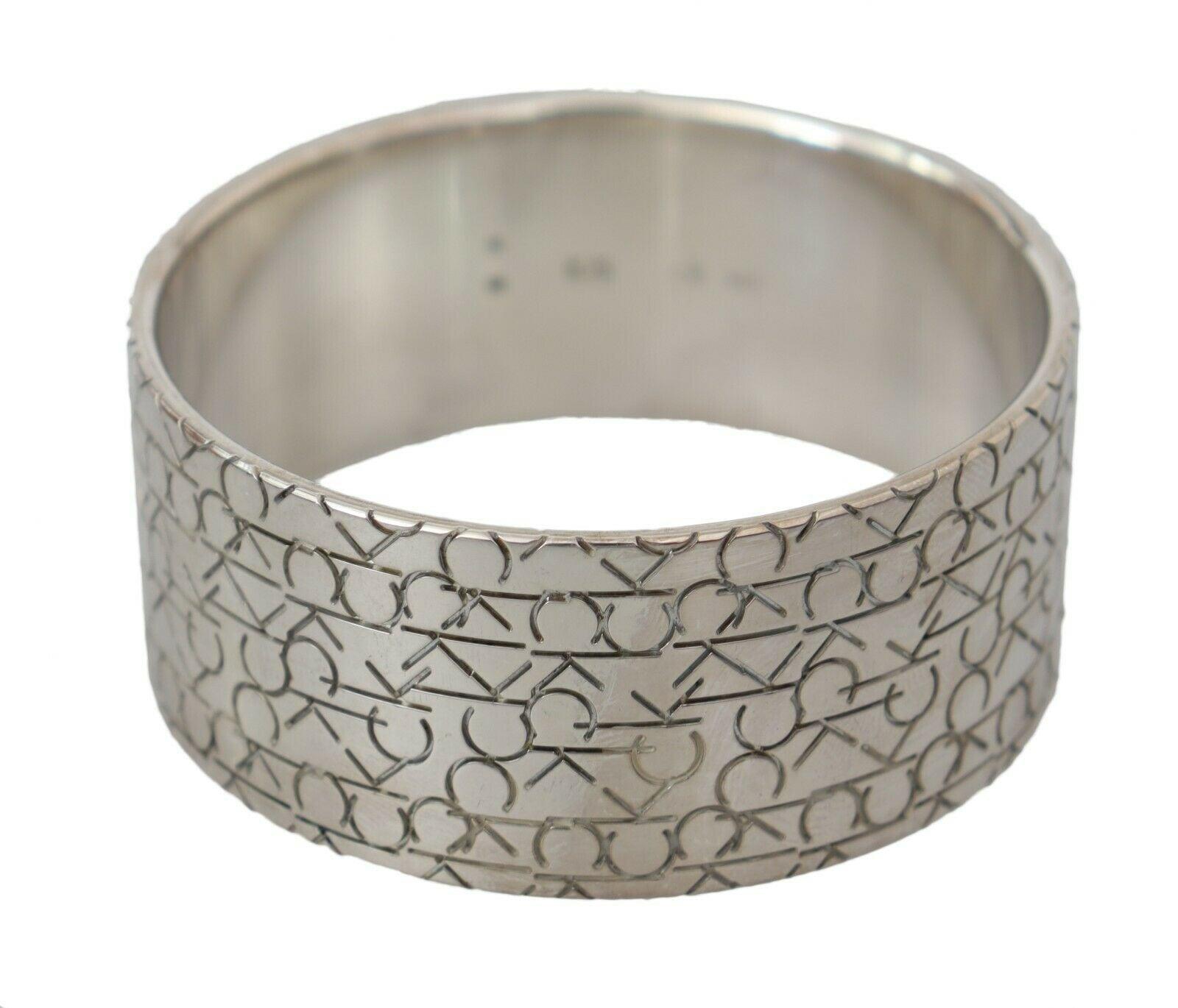 Silver Logo Bangle 160gram 925 Sterling Silver Bracelet designed by Calvin Klein available from Moon Behind The Hill 's Jewelry > Rings > Womens range
