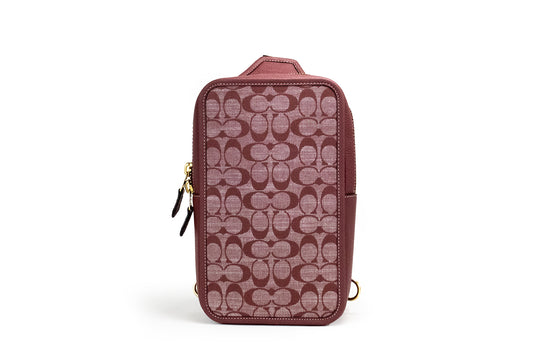 Coach Sullivan Wine Chambray Canvas Pebbled Leather Crossbody Pack Bag - Designed by COACH Available to Buy at a Discounted Price on Moon Behind The Hill Online Designer Discount Store