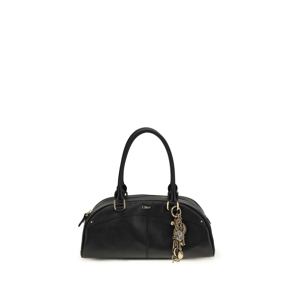 Large Shoulder Bowling Bag by Chloé for women in bos taurus calfskin leather black features a stately silhouette, showcasing a secure zipper, ample , and stately shoulder-strap & handle for a stately finish.