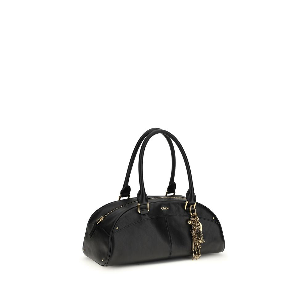 Large Shoulder Bowling Bag by Chloé for women in bos taurus calfskin leather black features a effortless chic silhouette with a secure zipper, ample , and versatile shoulder-strap & handle for a effortless chic finish.