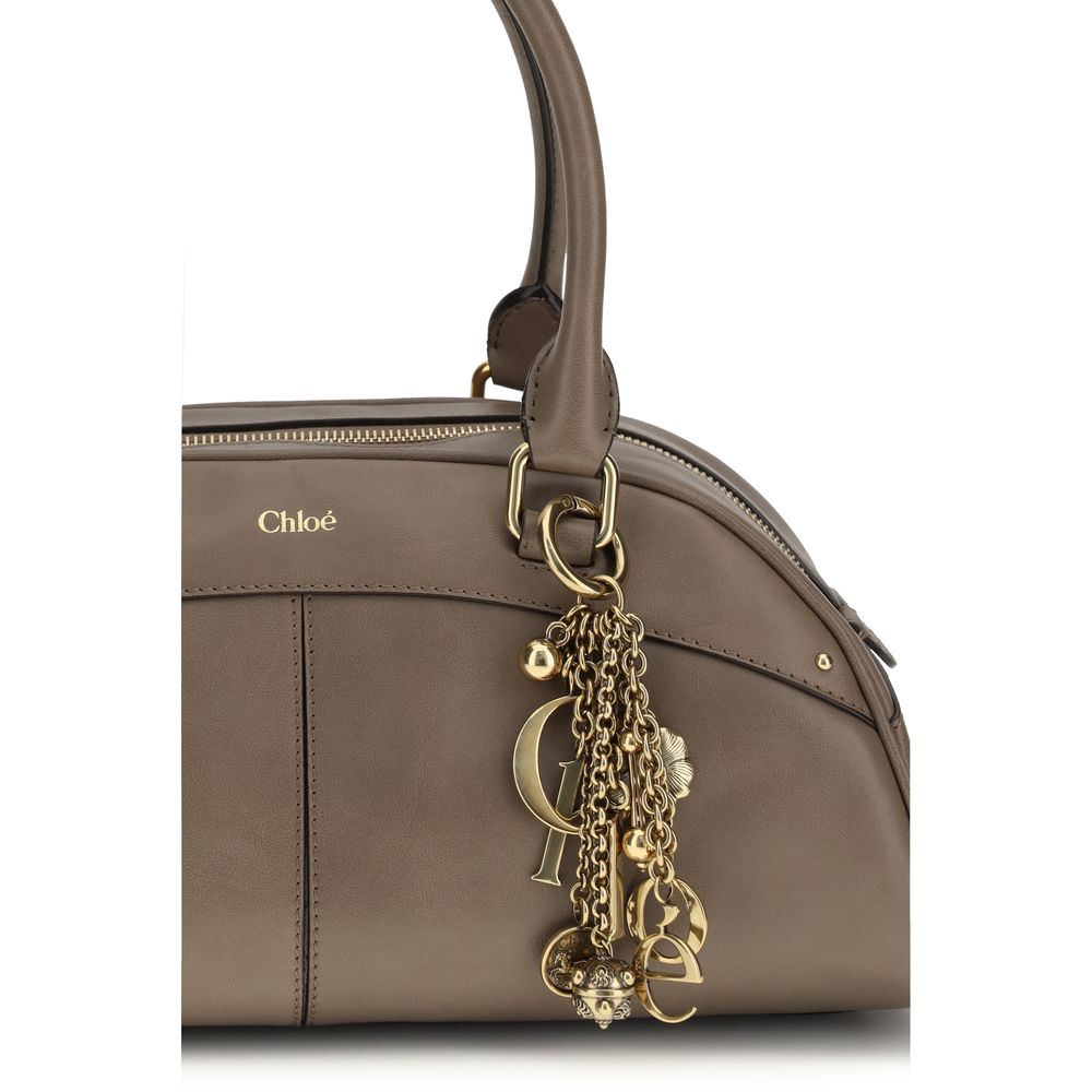 Large Bowling Handbag by Chloé for women in bos taurus calfskin leather gray presents a ornamental silhouette, showcasing a secure zipper, ample , and versatile handle for a ornamental finish.