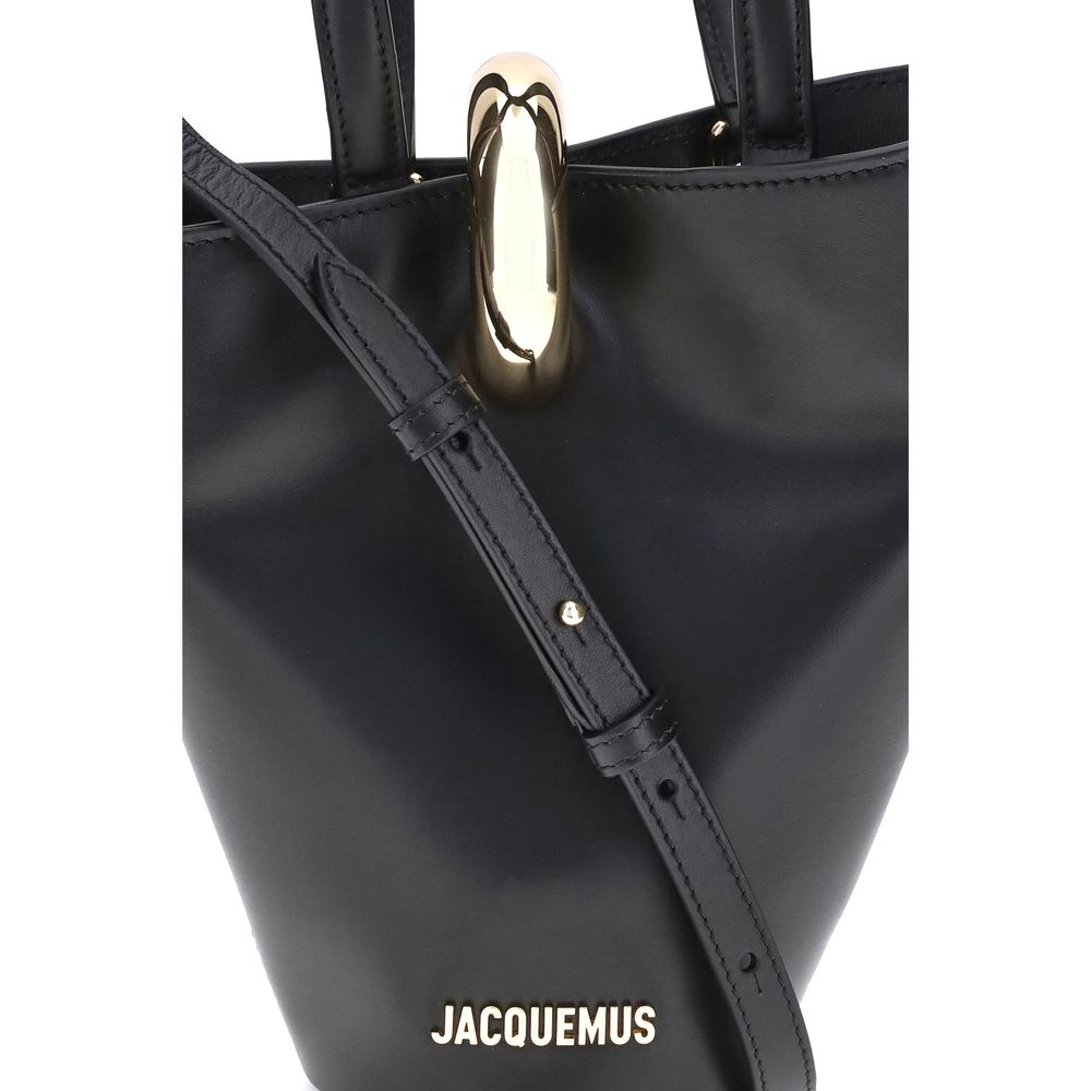 Small Shoulder Bucket Bag by Jacquemus for women in bos taurus calf leather black & gold features a statuesque silhouette, showcasing a secure zipper and statuesque single-compartment with versatile shoulder-strap, handle & adjustable-strap for a statuesque finish.