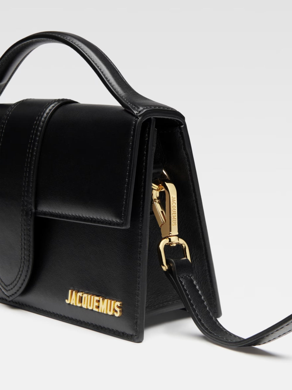 Small Crossbody Flap Handbag by Jacquemus for women in leather black & gold showcases a versatile sophistication silhouette, featuring a secure flap & magnetic, versatile sophistication cardholder, and versatile crossbody-strap, shoulder-strap, adjustable-strap & handle for a versatile sophistication finish.