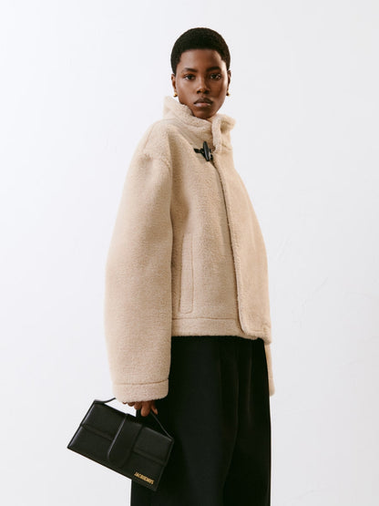 Small Crossbody Flap Handbag by Jacquemus for women in leather black & gold features a transformative sophistication silhouette, showcasing a secure flap & magnetic, ample cardholder, and versatile crossbody-strap, shoulder-strap, adjustable-strap & handle for a transformative sophistication look.