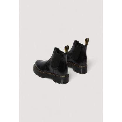 Ankle Winter Boots by Dr. Martens for women in leather black features an dynamic silhouette, showcasing the dynamic Women's Leather Ankle Winter Boots design with its distinctive and elegant .