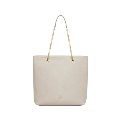 Tote Handbag by Calvin Klein for women in polyethylene & polyurethane beige & gold features a signature silhouette, showcasing a secure drawstring and signature with versatile handle for a sophisticated look.