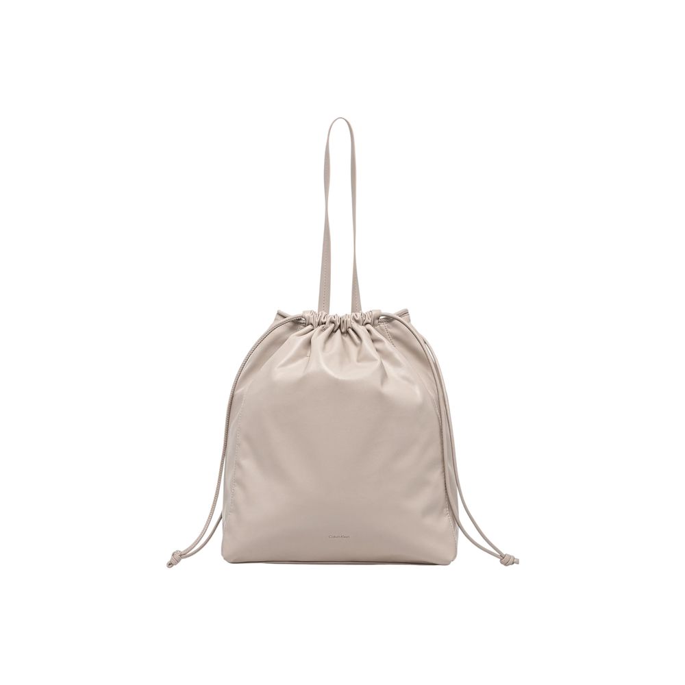 Tote Handbag by Calvin Klein for women in polyethylene & polyurethane beige features a ornamental silhouette, showcasing a secure drawstring, ample , and ornamental handle for a sophisticated look.