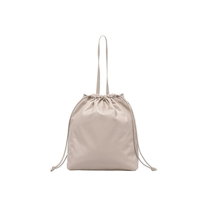 Tote Handbag by Calvin Klein for women in polyethylene & polyurethane beige features a ornamental silhouette, showcasing a secure drawstring, ample , and ornamental handle for a sophisticated look.