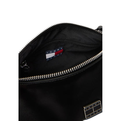 Shoulder Handbag by Tommy Hilfiger Jeans for women in leather black features a signature silhouette, showcasing a secure zipper and signature with versatile shoulder-strap for a sophisticated look.