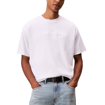 T-Shirt by Calvin Klein for men in cotton white showcases a unassuming silhouette, artfully detailed with a refined and unassuming for a sophisticated, contemporary look.