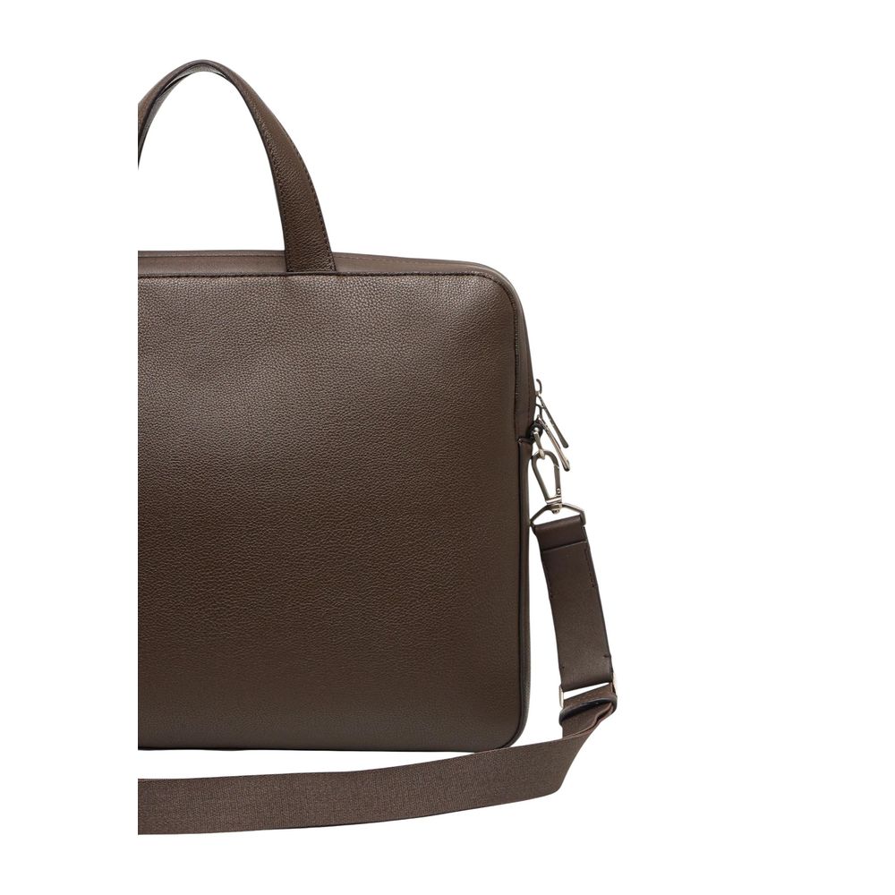 Briefcase by Calvin Klein for men in polyester polyurethan & polyethylene brown showcases a architectural Polyester Polyurethan & Polyethylene Briefcase design, featuring a secure zipper with organized and versatile shoulder-strap, adjustable-strap, detachable-strap & handle for a architectural look.