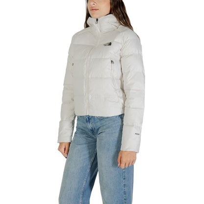 Hooded Overcoat by The North Face for women in nylon cream showcases a enveloping silhouette, detailed with distinctive thermal, pockets, hooded & insulated and a enveloping hooded neckline.