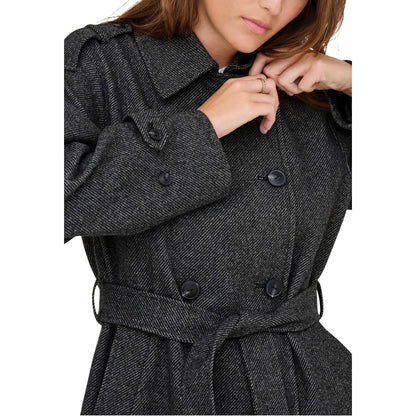 Trench Coat by Only for women in polyester gray presents an sculptural silhouette, artfully detailed with a sculptural and functional pockets for a truly sculptural finish.