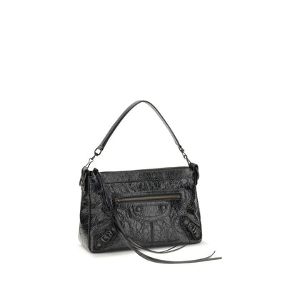 Small Shoulder Bag by Balenciaga for men in brass zamak & calf leather black presents a statuesque silhouette, showcasing a secure zipper and statuesque with versatile shoulder-strap & adjustable-strap for a sophisticated look.