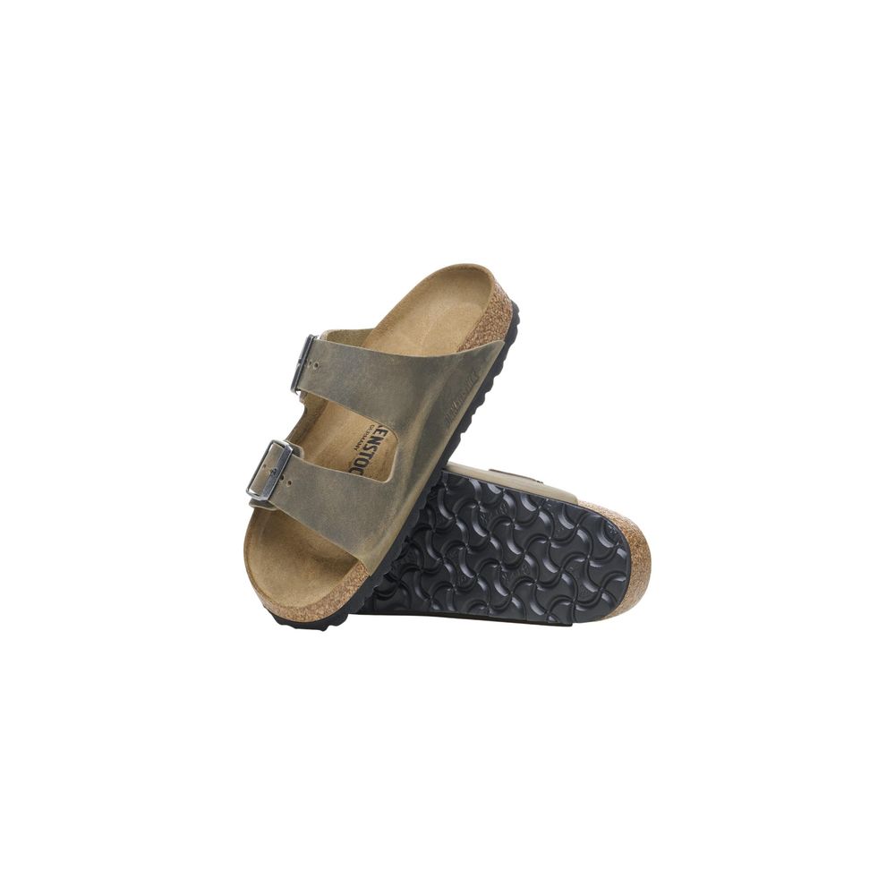 Flat Sandals by Birkenstock for men in leather & cork features an architectural design from the Men's Leather & Cork Flat Sandals collection, defined by a architectural flat and for a architectural finish.