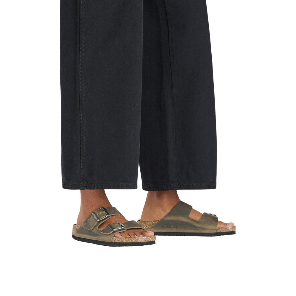 Flat Sandals by Birkenstock for men in leather & cork and presents a sculptural silhouette, showcasing the signature style of the Men's Leather & Cork Flat Sandals with a sculptural flat and sculptural .