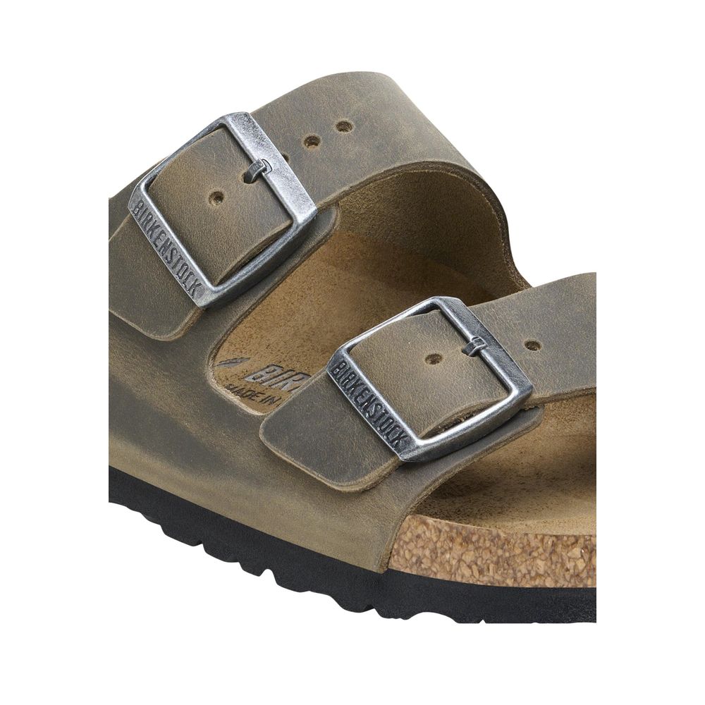 Flat Sandals by Birkenstock for men in leather & cork features an statuesque silhouette from the Men's Leather & Cork Flat Sandals collection, showcasing a statuesque flat and elegant .