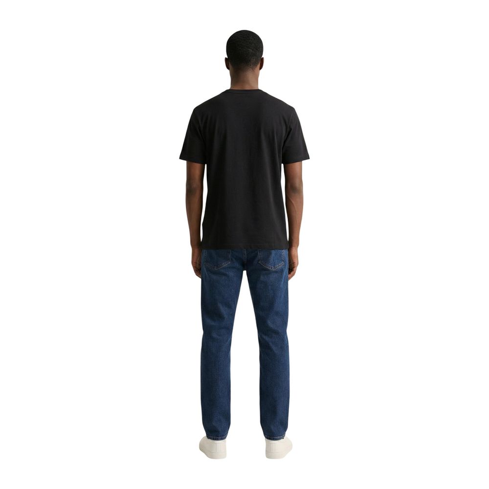 T-Shirt by Colmar Originals for men in cotton black showcases a fashionable silhouette, elegantly detailed with a fashionable and crew neckline for a sophisticated, high-fashion look.