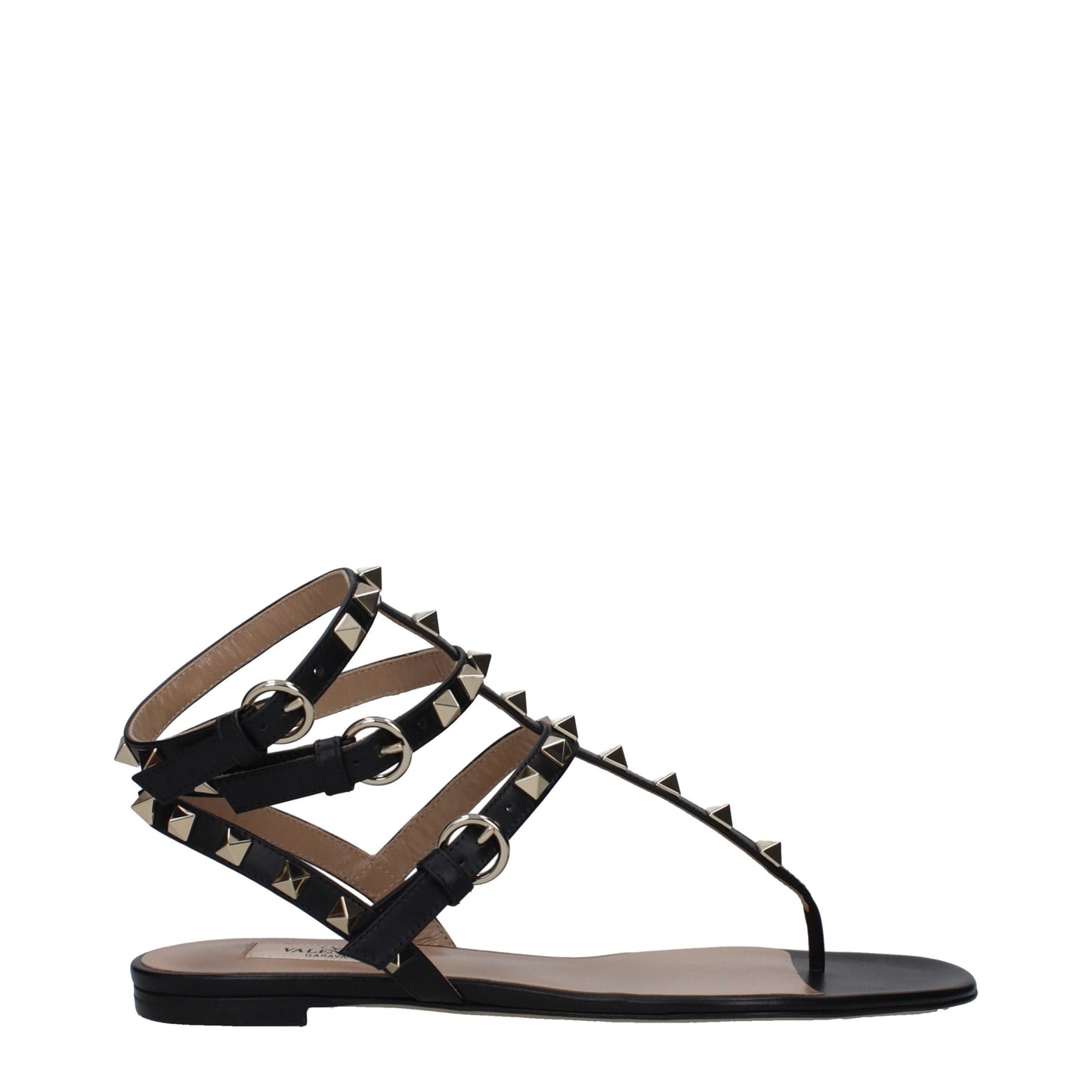 Flat Flip-Flop Sandals by Valentino Garavani for women in leather and black & gold presents a captivating silhouette, showcasing the signature style of the Women's Leather Flat Flip-Flop Sandals with a captivating flat and captivating open toe style.