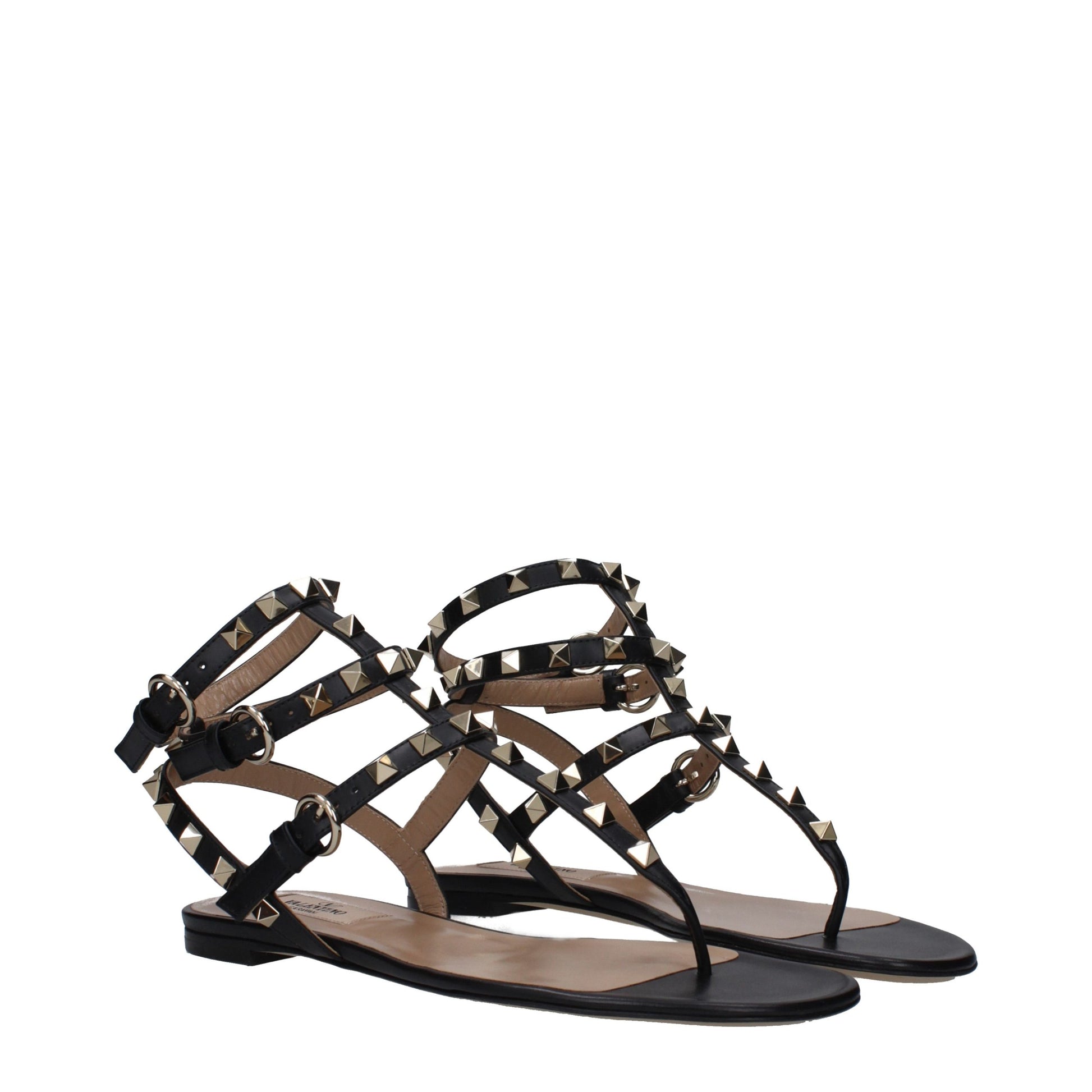 Flat Flip-Flop Sandals by Valentino Garavani for women in leather black & gold features an exquisite silhouette, showcasing the exquisite Women's Leather Flat Flip-Flop Sandals with a flat and open toe style.