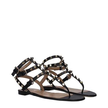 Flat Flip-Flop Sandals by Valentino Garavani for women in leather black & gold features an exquisite silhouette, showcasing the exquisite Women's Leather Flat Flip-Flop Sandals with a flat and open toe style.