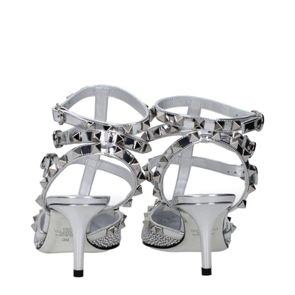 Stiletto Sandals by Valentino Garavani for women in patent leather gray & silver presents a sculptural silhouette, showcasing the Women's Patent Leather Stiletto Sandals design with a sculptural stiletto and for a premium look.