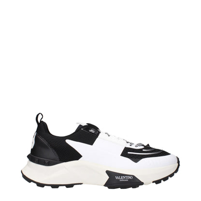Athletic Sneakers by Valentino Garavani for men in fabric black presents a sleek silhouette, perfectly capturing the athletic style essence of Men's Athletic Fabric Sneakers with its sleek design and premium finish.