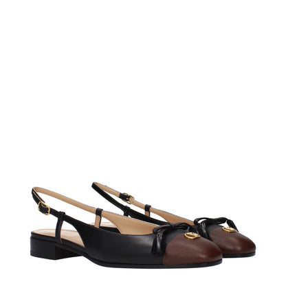 Ballet Flat Shoes by Valentino Garavani for women in leather black & gold showcases a enchanting silhouette as part of the Women's Leather Ballet Flat Shoes collection, defined by a enchanting round toe style and for a enchanting look.