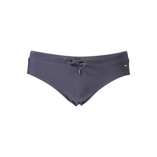 This Swimwear by Tommy Hilfiger for men in stretch polyester blue & signature showcases a eye catching silhouette from the Men's Stretch Polyester Swimwear collection, featuring a eye catching cut designed for poolside elegance.