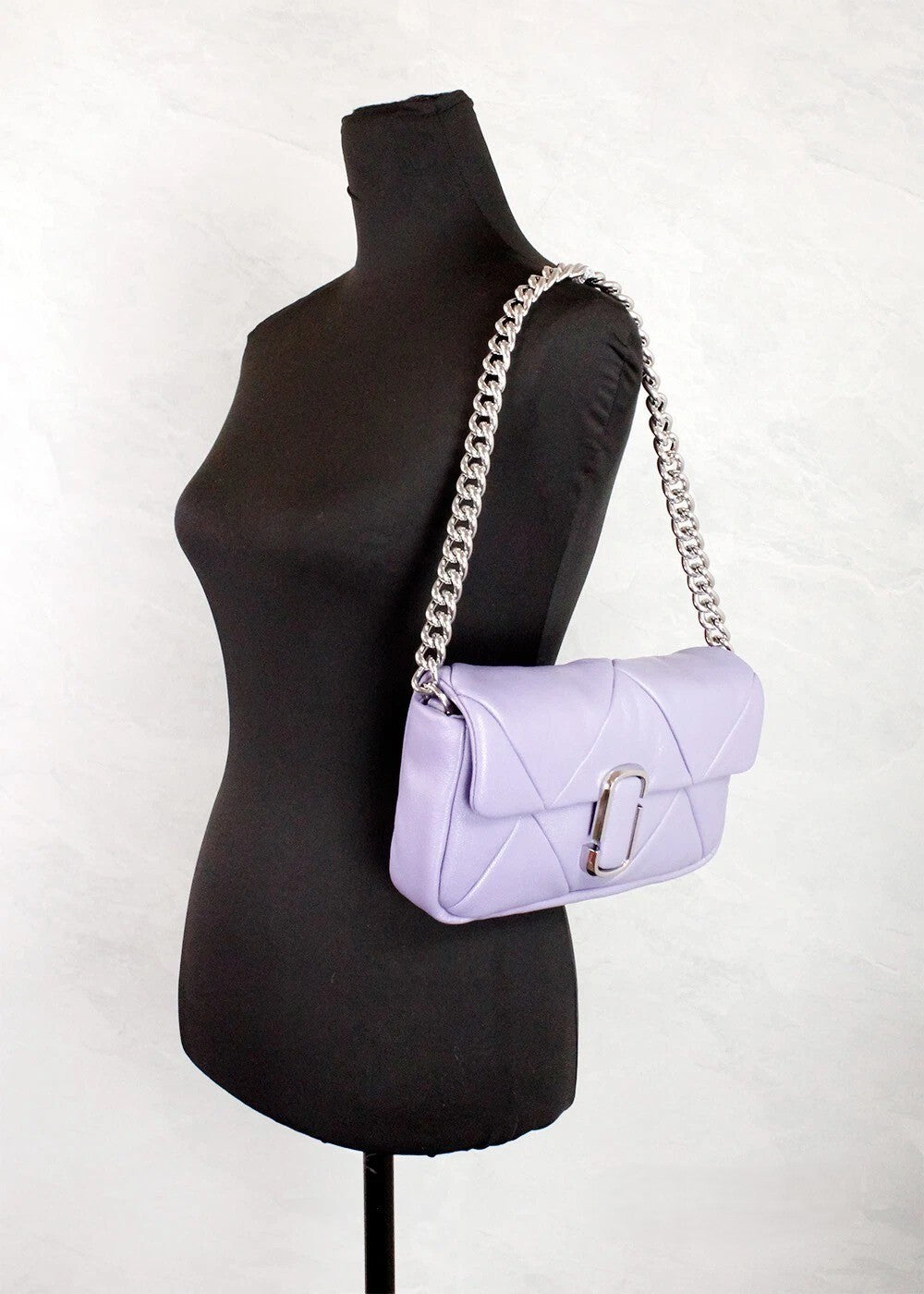 Medium Quilted Crossbody Travel Handbag by Marc Jacobs for women in leather purple, silver & signature features a multifaceted silhouette, showcasing a secure zipper & magnetic and multifaceted with versatile crossbody-strap, shoulder-strap, adjustable-strap & detachable-strap for multifaceted style.