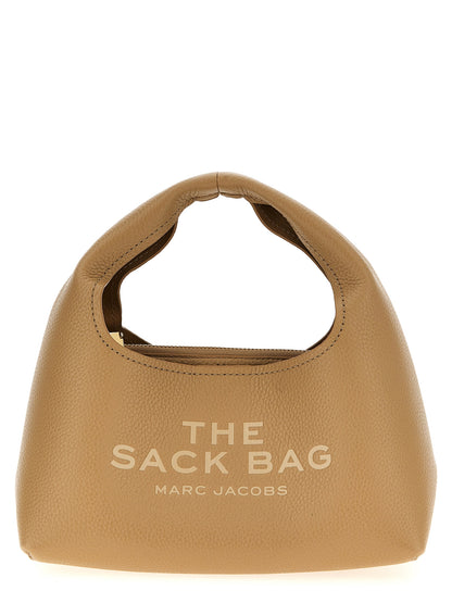 This Mini Pouch Clutch Handbag by Marc Jacobs for women in bos taurus calf suede leather and beige presents a sculptural silhouette featuring a secure magnetic, ample , and versatile handle for a sculptural finish.