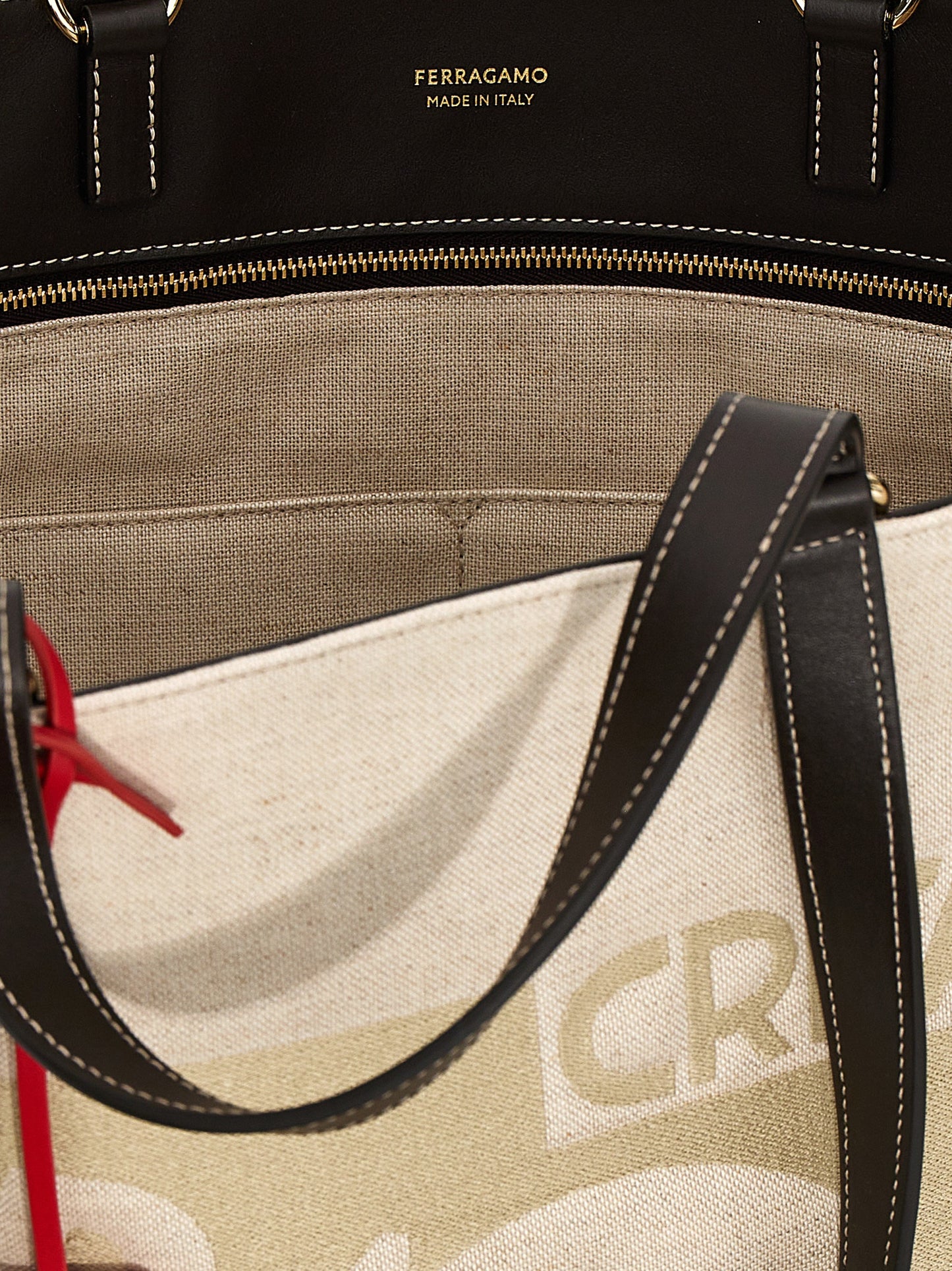 Tote Bag by Ferragamo for women in calfskin leather beige & jacquard features an jet-set Calfskin Leather Tote Bag design with a secure , ample , and versatile handle for an jet-set finish.