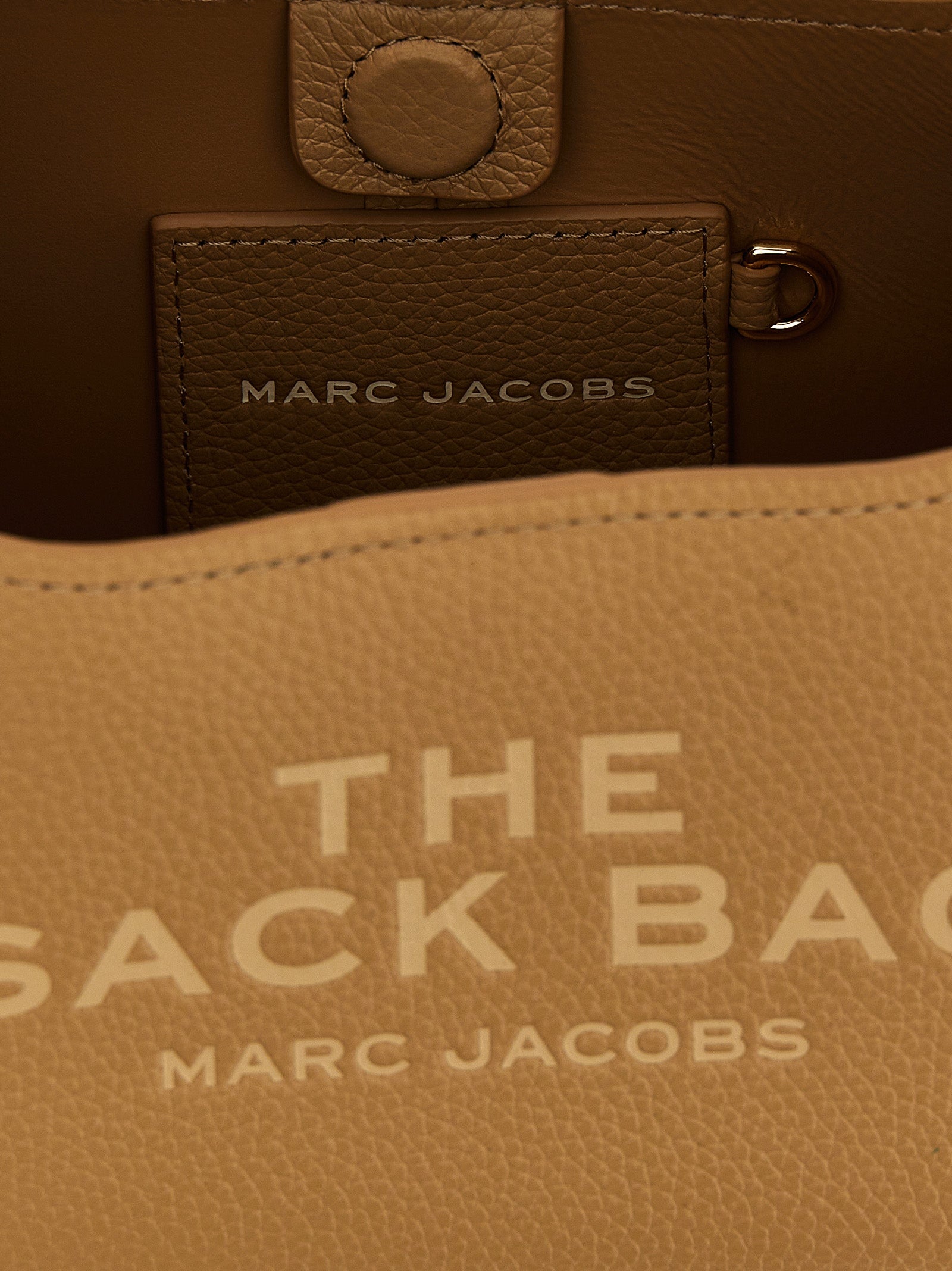 Mini Pouch Clutch Handbag by Marc Jacobs for women in bos taurus calf suede leather beige presents a ornamental silhouette, showcasing a secure magnetic, ample , and versatile handle for a ornamental finish.