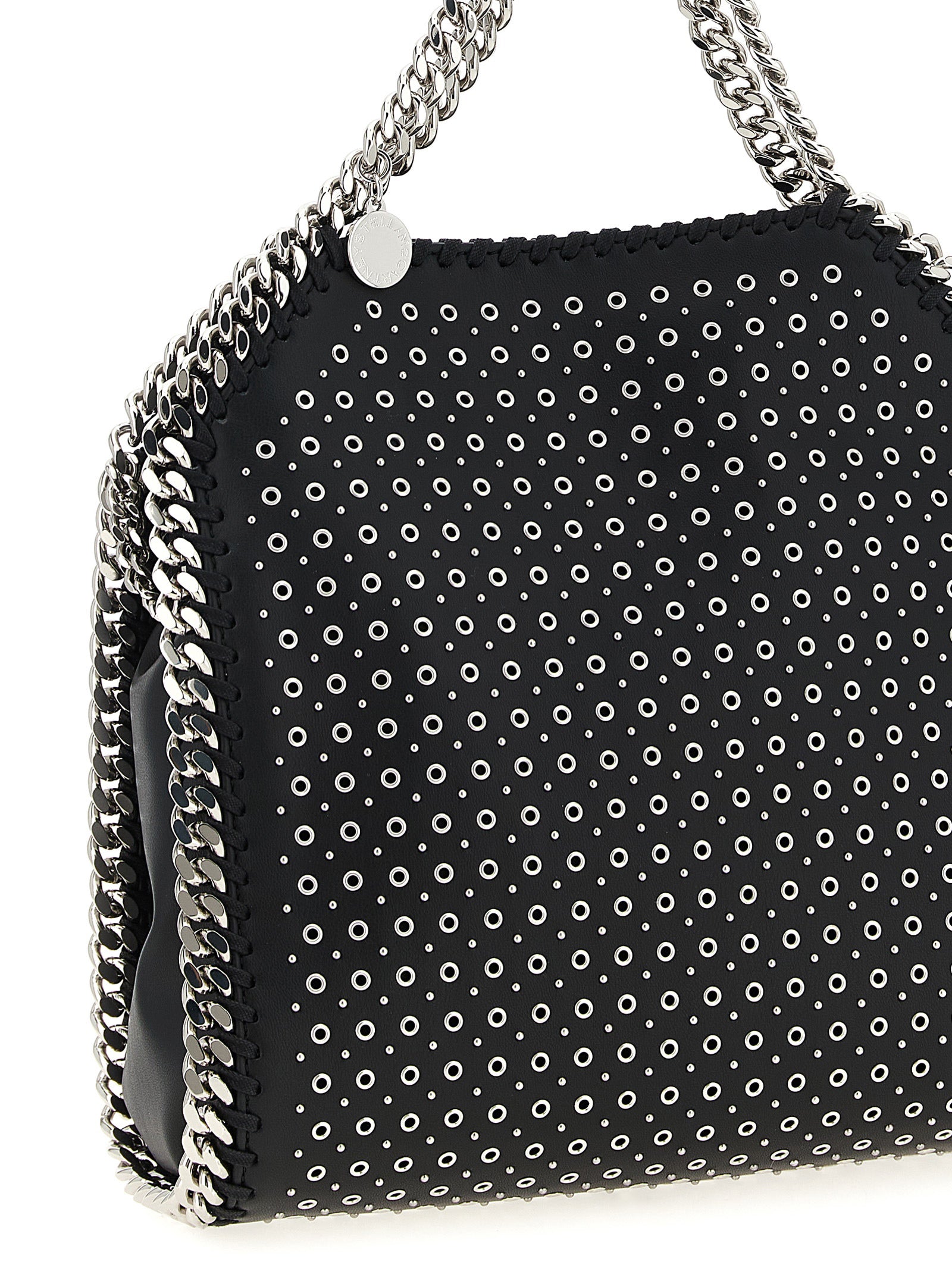 This Mini Handbag by Stella McCartney for women in faux patent leather and black presents a sculptural silhouette featuring a secure magnetic, ample , and versatile shoulder-strap & handle for a sculptural finish.