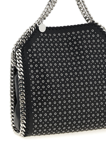 This Mini Handbag by Stella McCartney for women in faux patent leather and black presents a sculptural silhouette featuring a secure magnetic, ample , and versatile shoulder-strap & handle for a sculptural finish.
