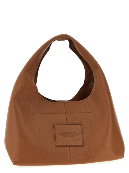 Medium Shoulder Clutch Bag by Marc Jacobs for women in bos taurus calf suede leather brown features a statuesque silhouette, showcasing a secure magnetic and statuesque with versatile shoulder-strap & handle for a statuesque finish.