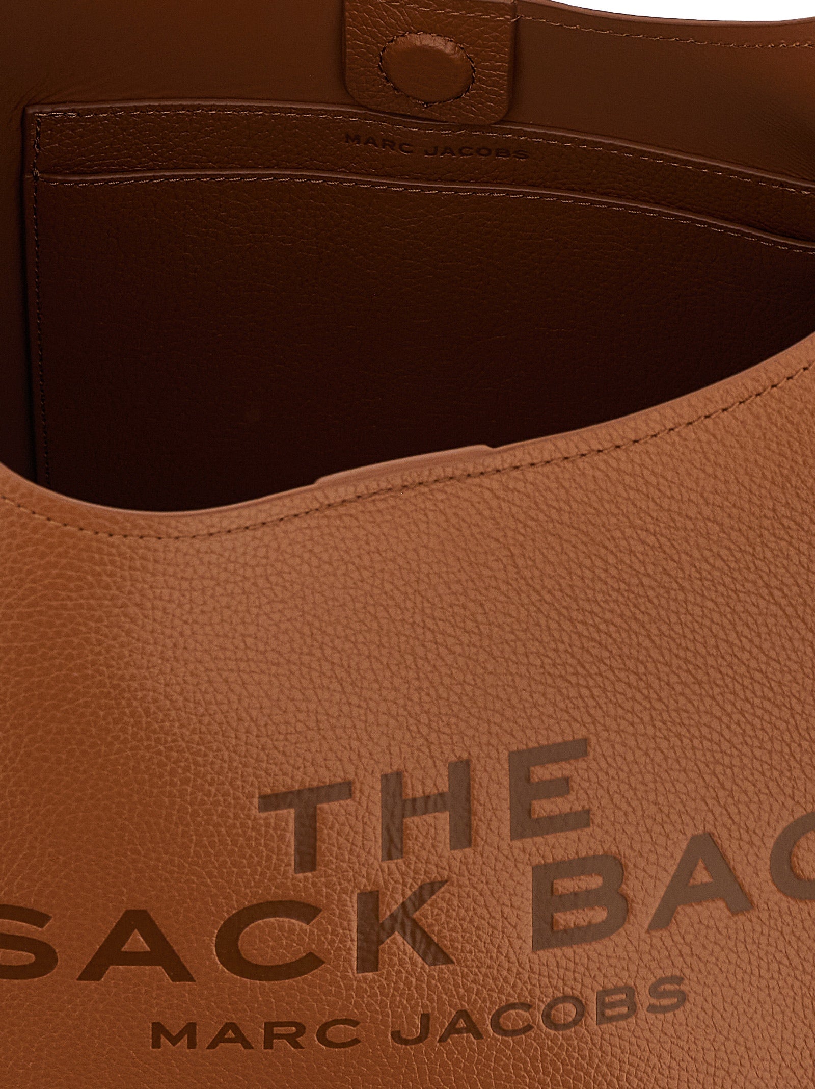 Medium Shoulder Clutch Bag by Marc Jacobs for women in bos taurus calf suede leather brown features a statuesque silhouette, showcasing a secure magnetic and statuesque with versatile shoulder-strap & handle for a statuesque finish.