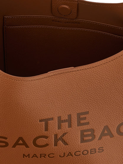 Medium Shoulder Clutch Bag by Marc Jacobs for women in bos taurus calf suede leather brown features a statuesque silhouette, showcasing a secure magnetic and statuesque with versatile shoulder-strap & handle for a statuesque finish.