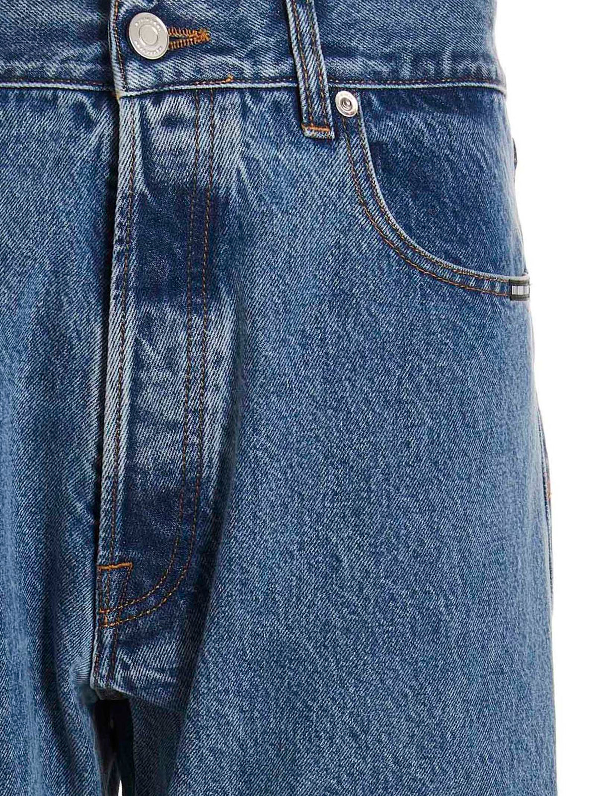 Jeans by VTMNTS for men in denim cotton blue presents a tailored silhouette, showcasing a tailored straight-leg, relaxed-fit & oversized and long cut with a refined for a truly tailored aesthetic.