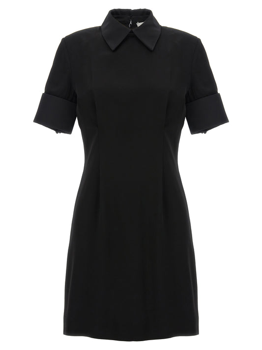 Dress by Sportmax for women in satin viscose black features an eye catching silhouette with a sophisticated , elegant , and a refined short mini for a eye catching aesthetic.