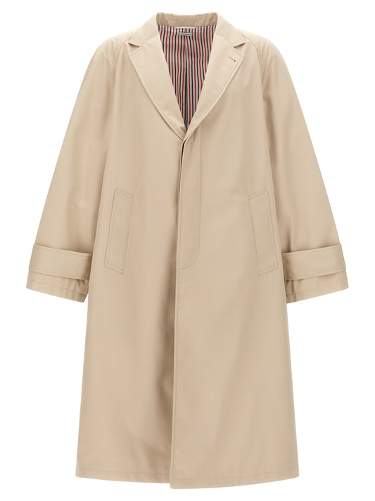 Trench Coat by Thom Browne for men in polyester polyurethane cotton beige showcases a contemporary silhouette, detailed with a contemporary and distinctive pockets for a truly contemporary finish.